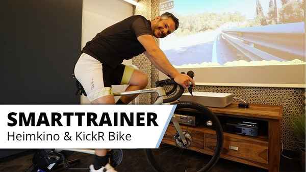Das ultimative Indoor Cycling Erlebnis - im Heimkino. Kickr Bike Smart Trainer mit großem Bild.